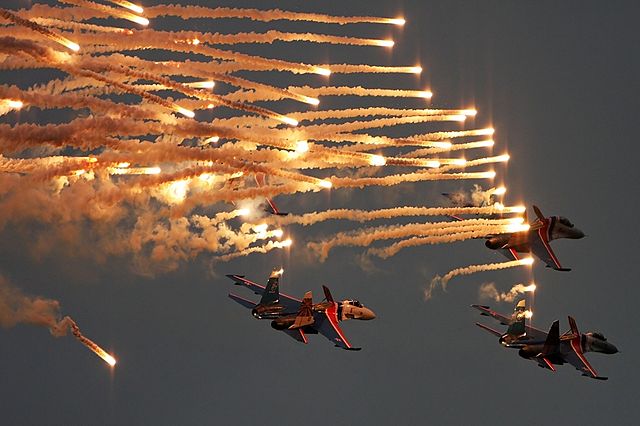 Russian Knights fire their flares as a salute to Igor Tkachenko.