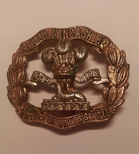 Cap badge of the South Lancashire Regiment.