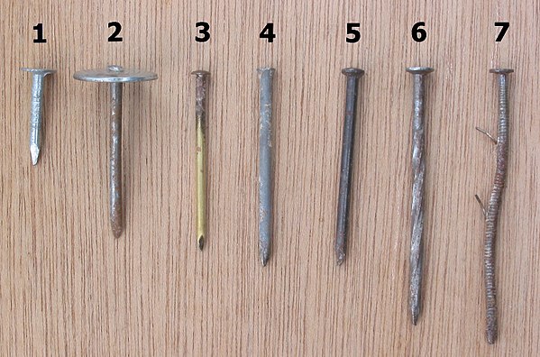 Different types of nails: 1) roofing 2) umbrella head roofing 3) brass escutcheon pin 4) finish 5) concrete 6) spiral-shank 7) ring-shank (a used, ben