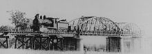 Biboohra bridge ~1895 StateLibQld 1 69219 Locomotive on the Biboohra Railway Bridge, Queensland, ca. 1895.jpg