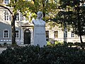 Bust of Attilio Hortis in the middle of Piazza Hortis