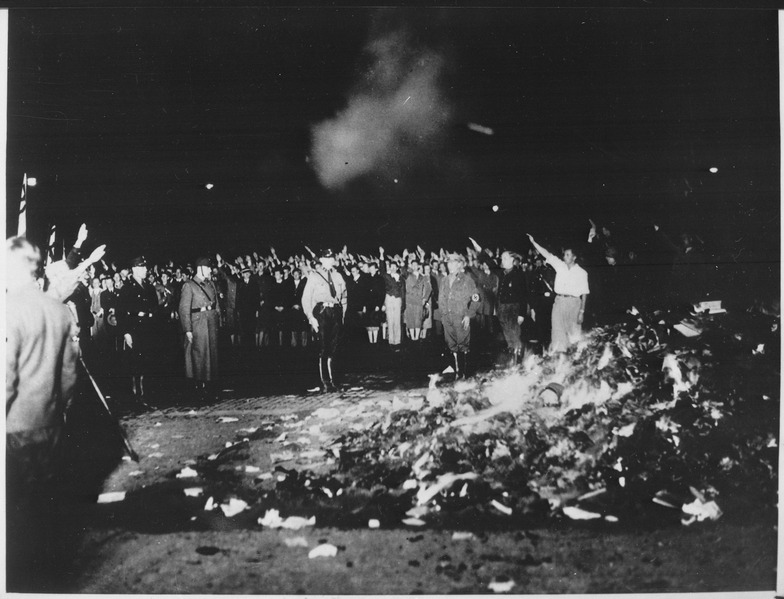 File:Thousands of books smoulder in a huge bonfire as Germans give the Nazi salute during the wave of book-burnings that... - NARA - 535791.tif