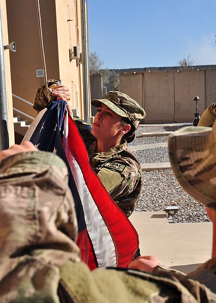 File:U.S. Air Force Airman 1st Class Christina Armour, with the 451st Expeditionary Logistics Readiness Squadron, prepares to raise a flag during a Veterans Day ceremony at Camp Losano, Kandahar Airfield 131111-F-BY961-066.jpg