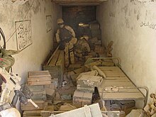 Within the cave US Navy 020114-N-8242C-004 Navy SEALs find Al Qaida weapons cache.jpg