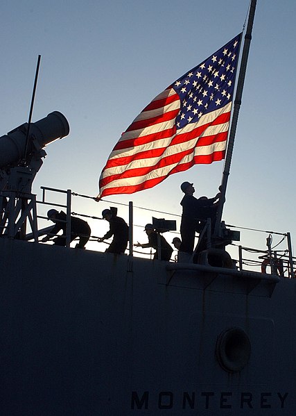 File:US Navy 070115-N-0780F-005 A Sailor hoists the national ensign as Sailors aboard guided missile cruiser USS Monterey (CG 61) conduct mooring operations upon their arrival at the Marathi NATO Pier Facility.jpg