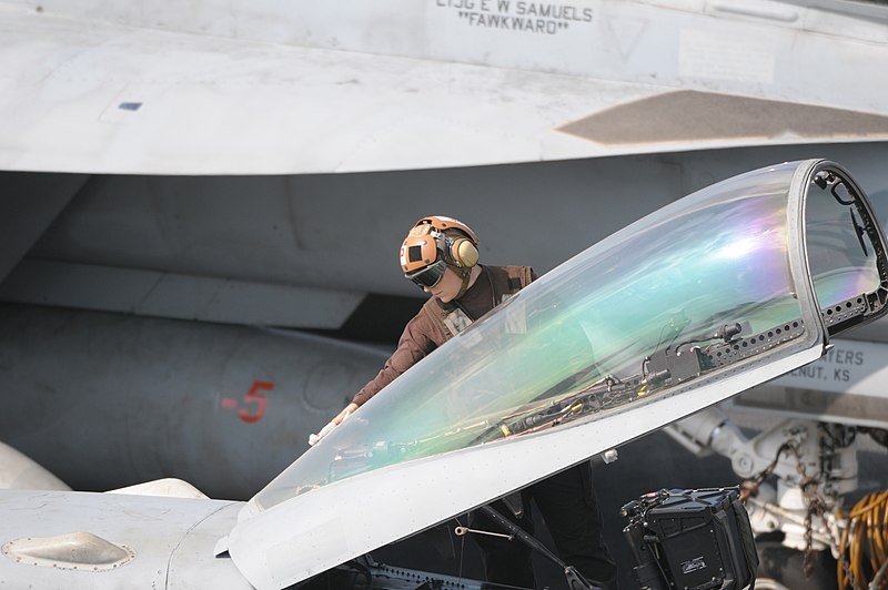 File:US Navy 120111-N-GZ832-336 A plane captain cleans the canopy of an F-A 18C Hornet on the flight deck aboard the Nimitz-class aircraft carrier USS C.jpg