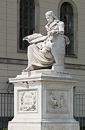 Statue of Wilhelm von Humboldt in front of the main building by artist Paul Otto. Wilhelm von Humboldt Denkmal - Humboldt Universitat zu Berlin.jpg