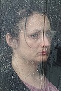 Woman in Rain-Streaked Bus Window - Odessa - Ukraine (26862783832).jpg