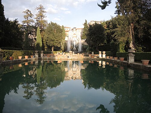 Reflection view of a park with beautiful buildings and fountains in Tivoli near Rome, Italy