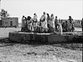 'At the well.' Crowds at (...) village well LOC matpc.16617.jpg