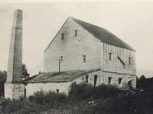 The Monroe City Mill in 1894.The two story section at right would have been built in 1827 by Thomas James. The lean-to and smokestack would have been built in 1851 when the mill was converted to steam power. 1894 Mill Best.jpg