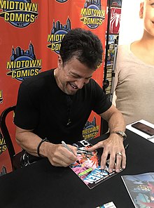 Artist John Romita Jr. signing a copy of The Uncanny X-Men #201, in which Nathan Christopher Charles Summers first appears as an infant