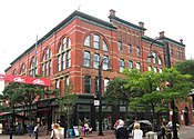 The former Howard Opera House (1878), now used for retail and commercial purposes, is part of the Church Street Historic District