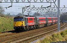 87005 City of London in 2002 in Virgin Trains' red and black livery. 87005 at Heamies Farm - 5709589620.jpg