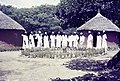 Teachers in training await the inspection of their huts, Toro Teachers College, Nigeria.