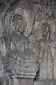 Ancient Buddhist Grottoes at Longmen- Southern Binyang Cave Main Buddha Attendants.jpg