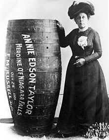 Annie Edson Taylor posing with her wooden barrel (1901) Annie Taylor.jpg