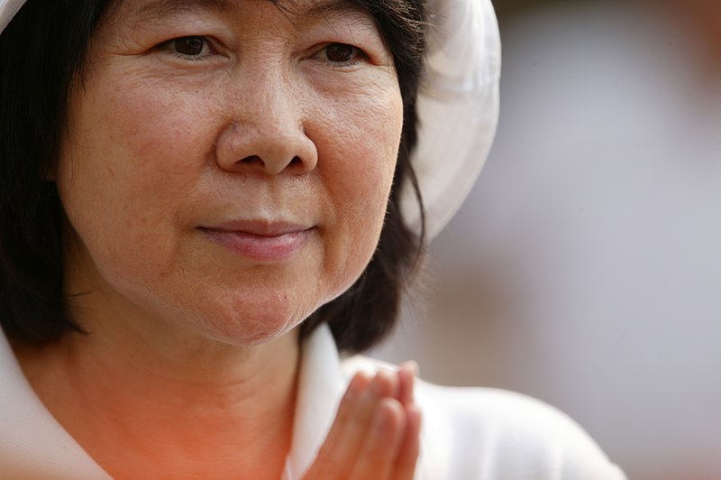 File:Asian woman making a resolve.jpg