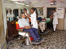 Independent, family-owned barbershops are a hallmark of Santiago