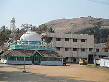 Begampur Mosque, the oldest mosque in the city, with Dindigul fort in the background