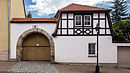 Blankenhain Rudolstädterstraße 8 round arched doorway with farm building.jpg