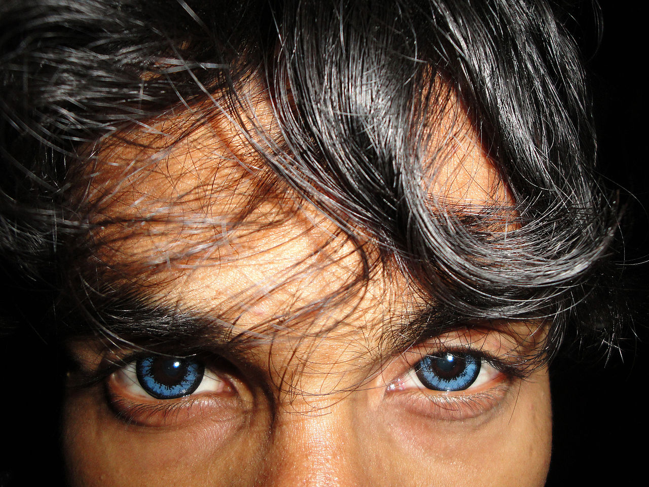 blue eyes black man