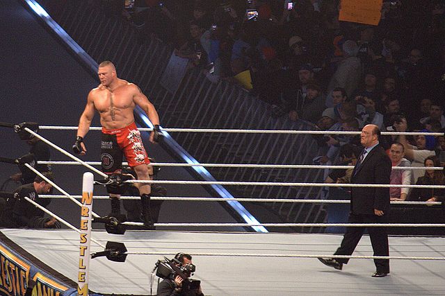 Brock Lesnar being accompanied by his "Advocate", Paul Heyman