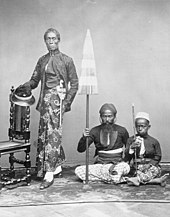 Javanese priyayi (aristocrat) and servants, c. 1865. COLLECTIE TROPENMUSEUM Portret van een Javaanse vorst of notabele met twee bedienden TMnr 60004903.jpg