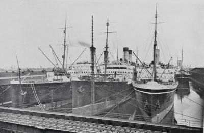 Three steamships docked together: Empress of France, Empress of India and Empress of Britain