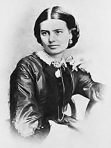 Black-and-white photograph of a woman with dark hair