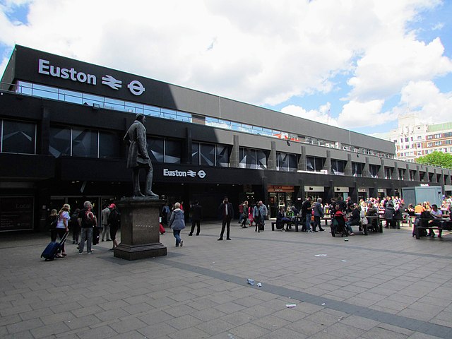 Station entrance in 2017, with the statue of Robert Stephenson