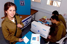 IDF soldier at voting booth Flickr - Israel Defense Forces - Female Soldier Votes in Israeli Government Elections (1).jpg
