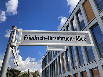 Sign for road named after mathematician Friedrich Hirzebruch on the Poppelsdorf campus, with the informatics forum behind it.