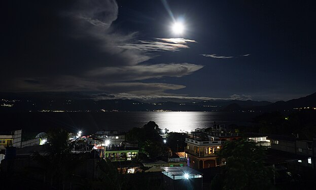 Caption of Full Moon over Lago Atitlan, seen from San Pedro