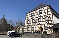 Inn, hall extension (formerly also cinema hall) and fountain in the cellar as well as outer wall of the former side building of an inn (Gasthof Theuma, Leopolds Gasthof)