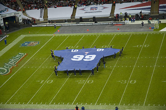 A giant Giants jersey is unfurled on the field at Wembley Stadium