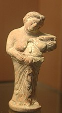 A grotesque woman holding a jar of wine, Kertch, second half of 4th century BC, Louvre. Grotesque woman Louvre CA2295.jpg
