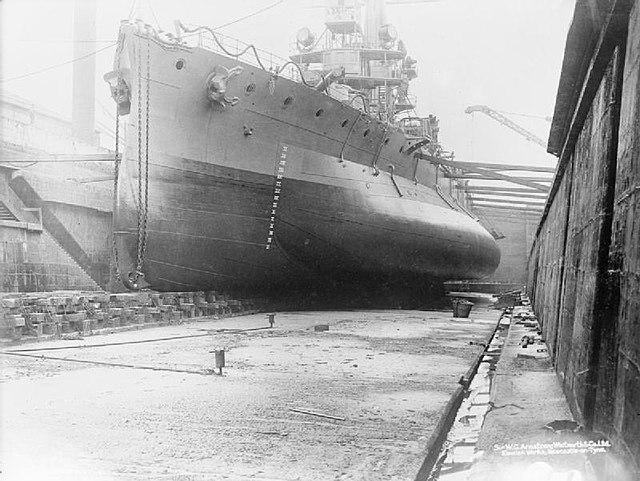 HMS Glatton in drydock, circa 1914–1918, showing her anti-torpedo bulge