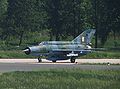Hrvatski: MiG-21 Hrvatskog ratnog zrakoplovstva na prilaznoj pisti Zračne luke Zagreb English: Croatian Mikoyan-Gurevich MiG-21 on Zagreb Airport runway