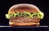A picture of a hamburger with three buns