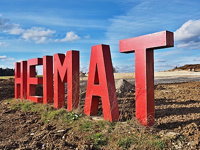 The German word "Heimat" ("Homeland") set in 6-feet-tall letters on a developing area