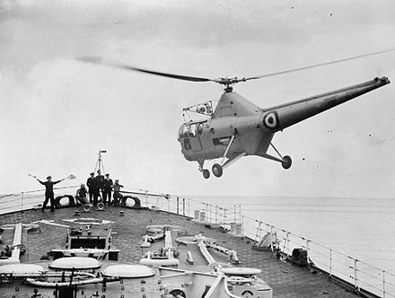 A Westland WS-51 Dragonfly coming in to land on the ship's foc'sle