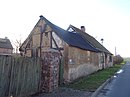 Residential house with attached farm building