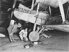 Preparing an R.E.8 for a night bombing raid IncendiaryBombsRE8.jpg