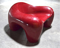 Prototype of a fiberglass armchair ..shaped from a block of foam at the hfg plaster workshop 1971