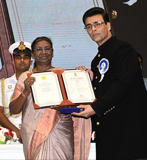 Johar receiving the National Film Award for Shershaah, c. 2023