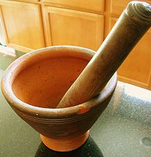 A Lao-style mortar and pestle Lao cuisine khok.jpg