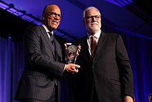 Holt receiving the Walter Cronkite Award for Excellence in Journalism Lester Holt & Mark Searle (49014770983).jpg