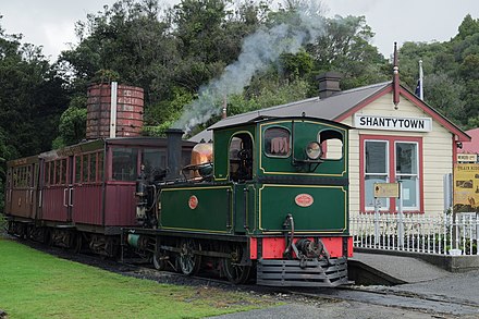 Vintage train at Shantytown station Locomotive NZR L 508 and two passenger carriages at Shantytown station.jpg