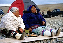 Canadian Inuit elders sharing muktuk, outside their summer tents, 2002 Maktaaq 2 2002-08-10.jpg